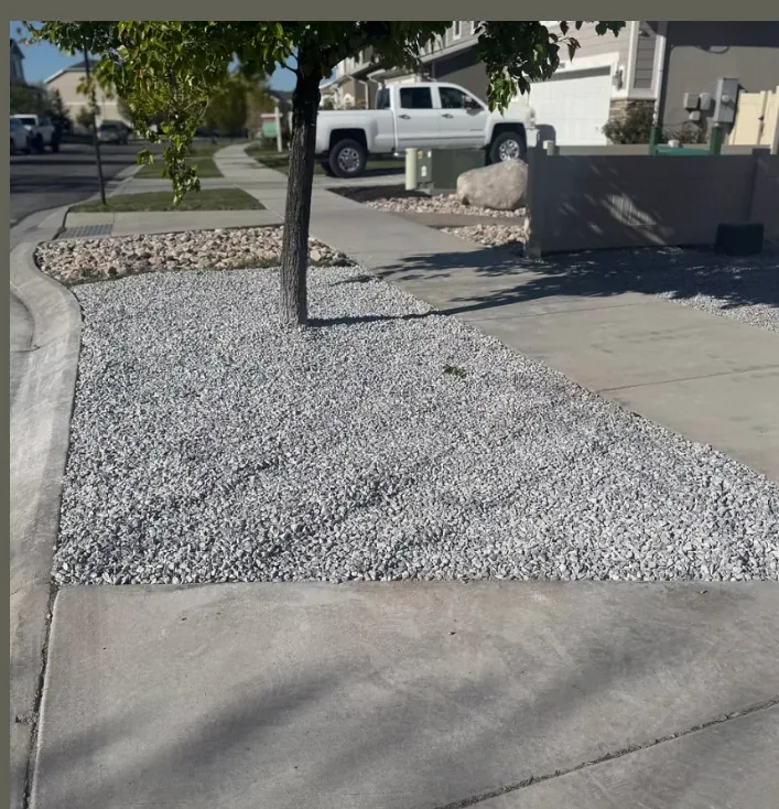 Herriman landscape project completed with rock and weed barrier
